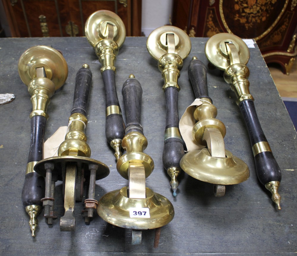 A set of four brass mounted ebony beer pumps, 46cm, another pair and one other beer pump